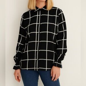 Who what wear black checked button down shirt with a ruffle cuffs. Size small